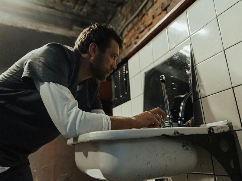 Man practicing evening mirror reset after successfully managing stress eating throughout the day
